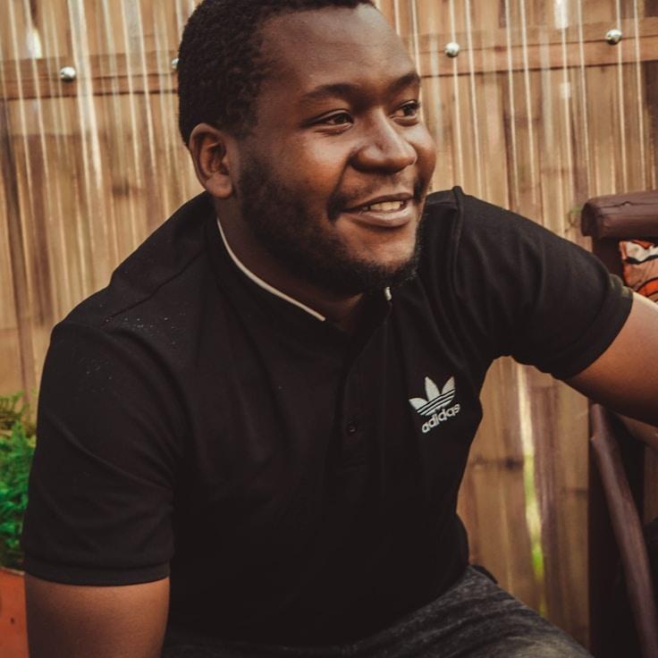 Avery Chen, Lead Design Curator at Dusk Wood Common, reviewing corporate floral arrangements